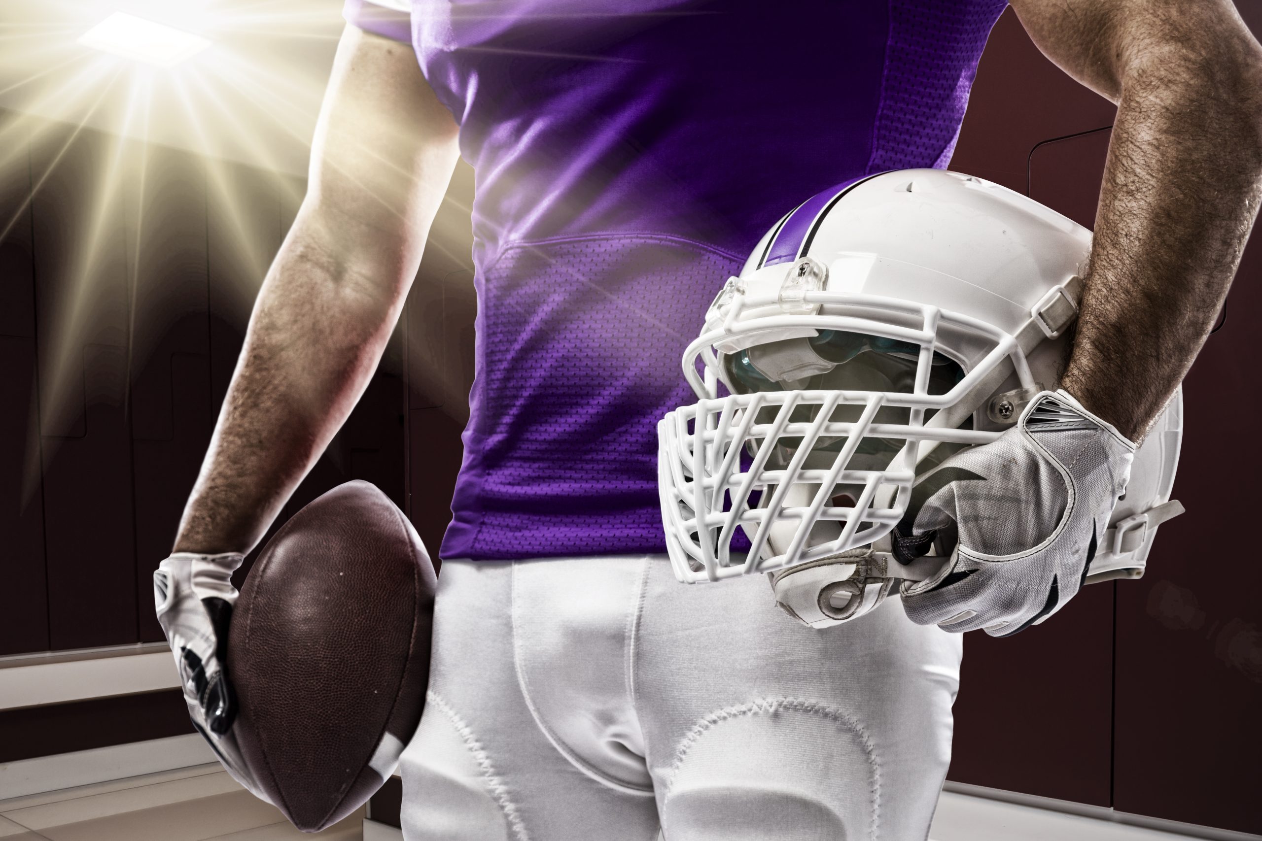 football-player-in-purple-jersey-holding-helmet-an-2026-01-11-10-07-17-utc